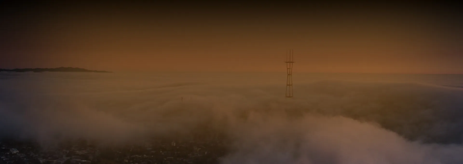 orange banner with clouds and antenna