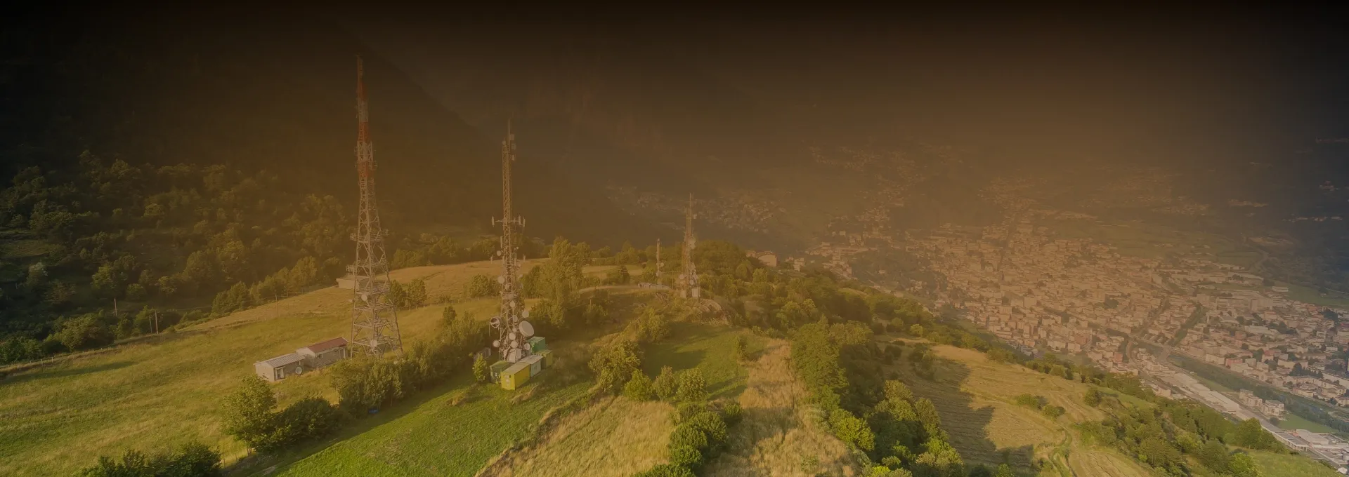 Green landscape banner with city and broadcast antennas